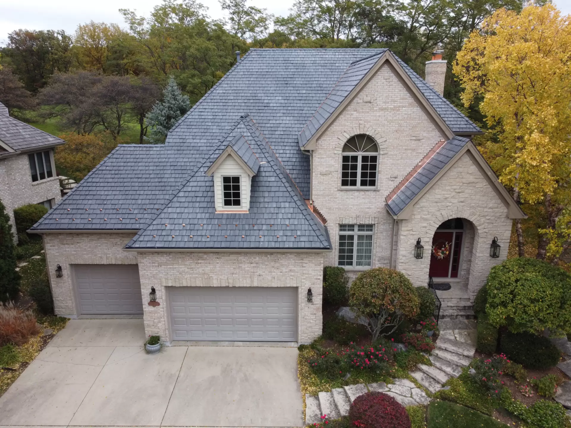 Large skylight next to window on grey roof