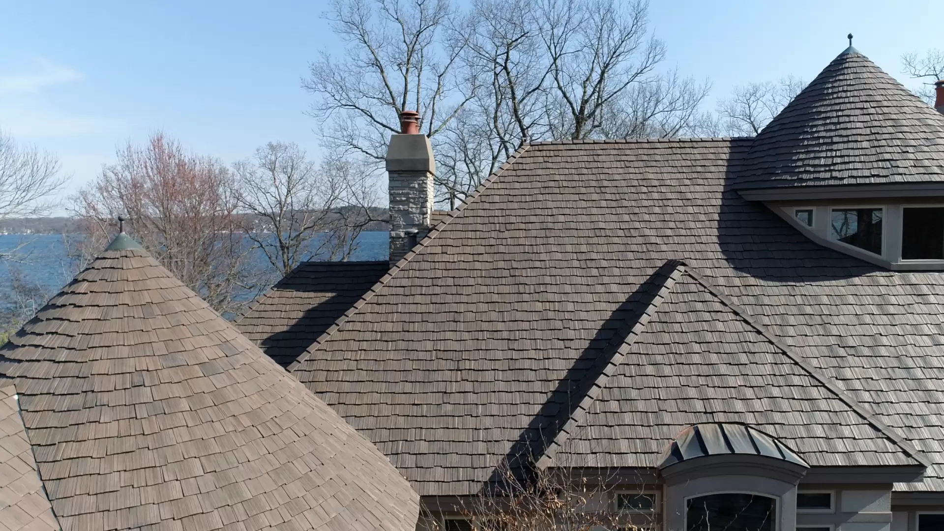 Large skylight next to window on grey roof