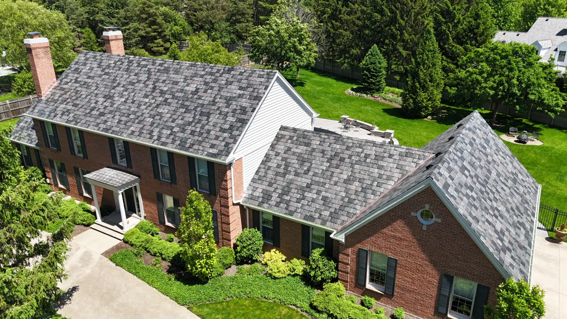 Large skylight next to window on grey roof