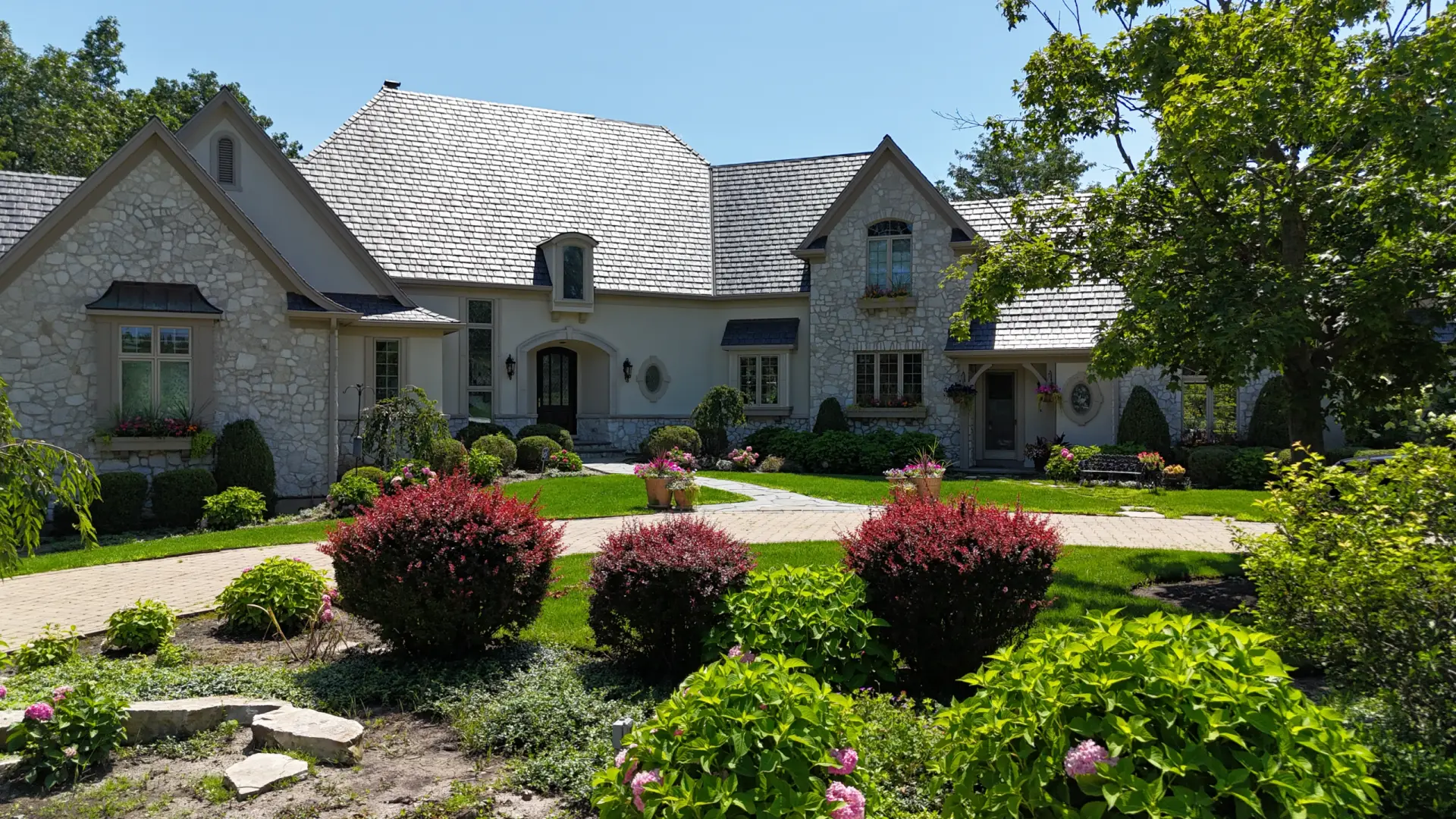 Large skylight next to window on grey roof