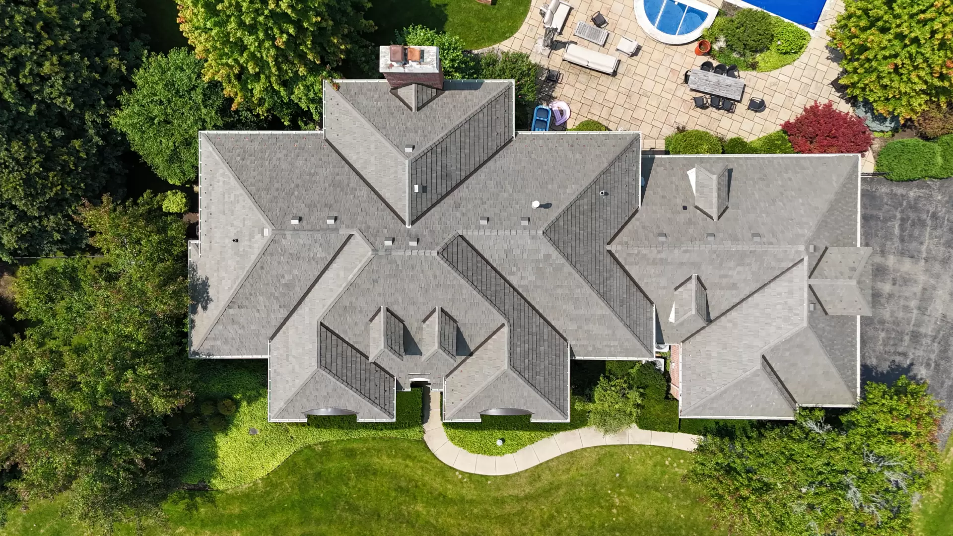 Large skylight next to window on grey roof