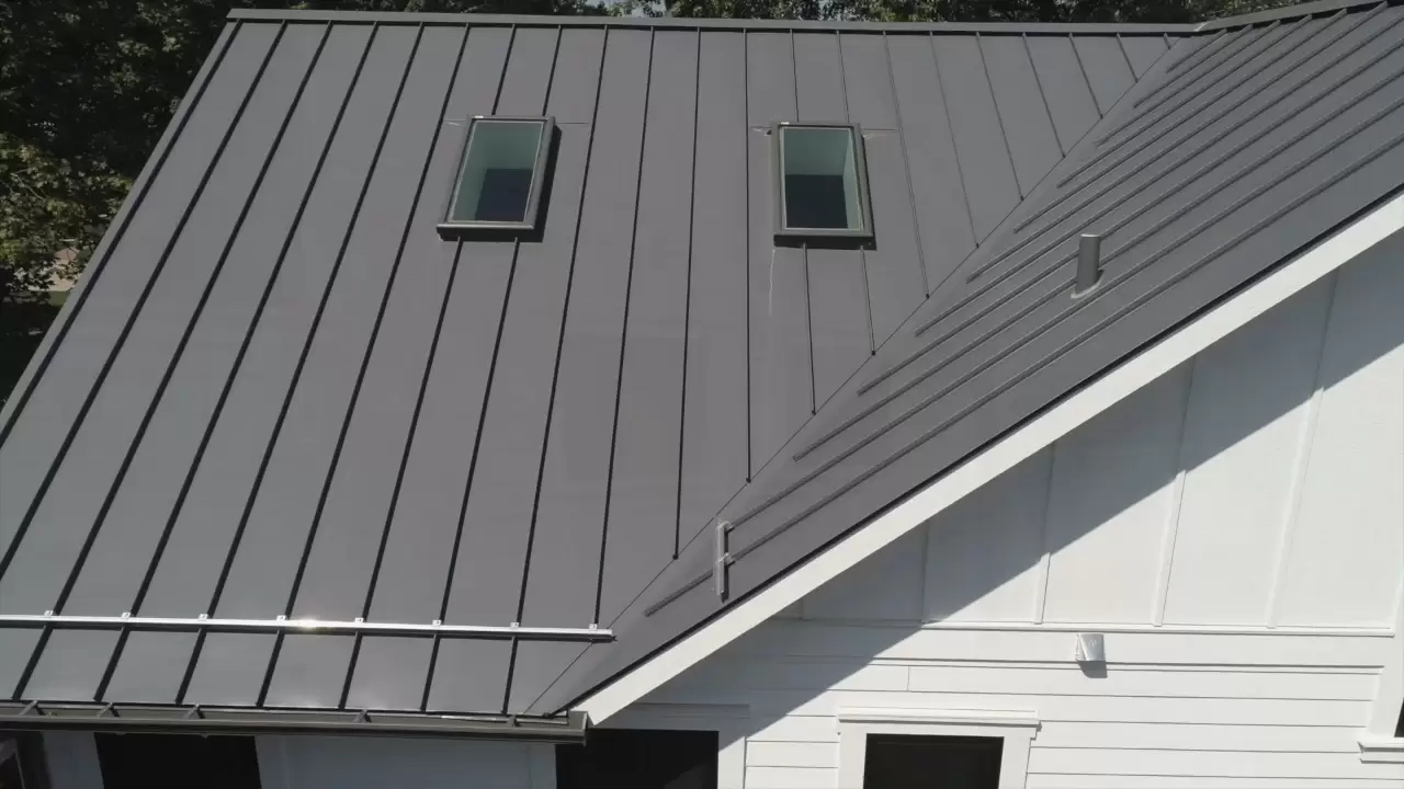 Two skylights on dark metal roof