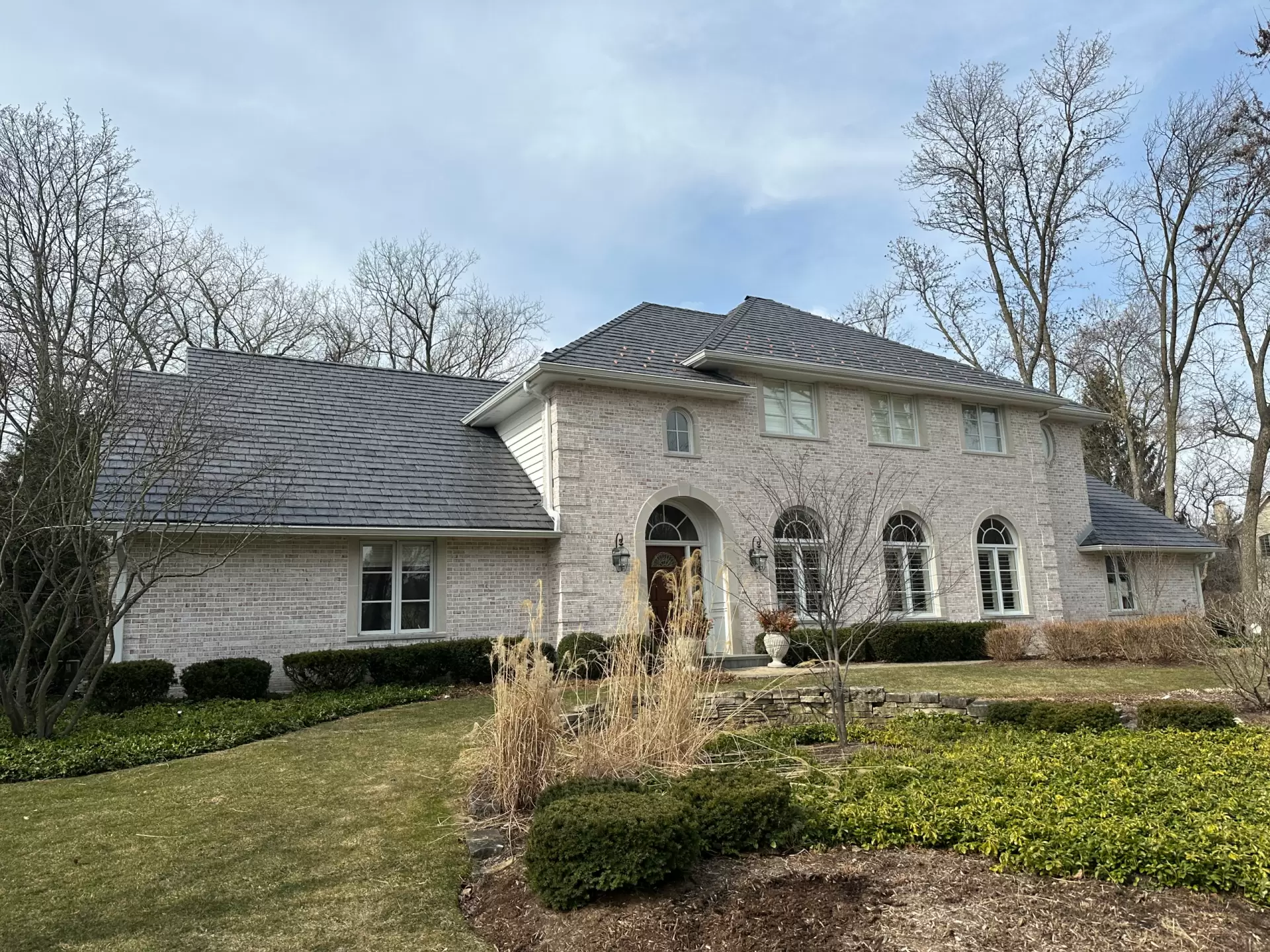 Large skylight next to window on grey roof
