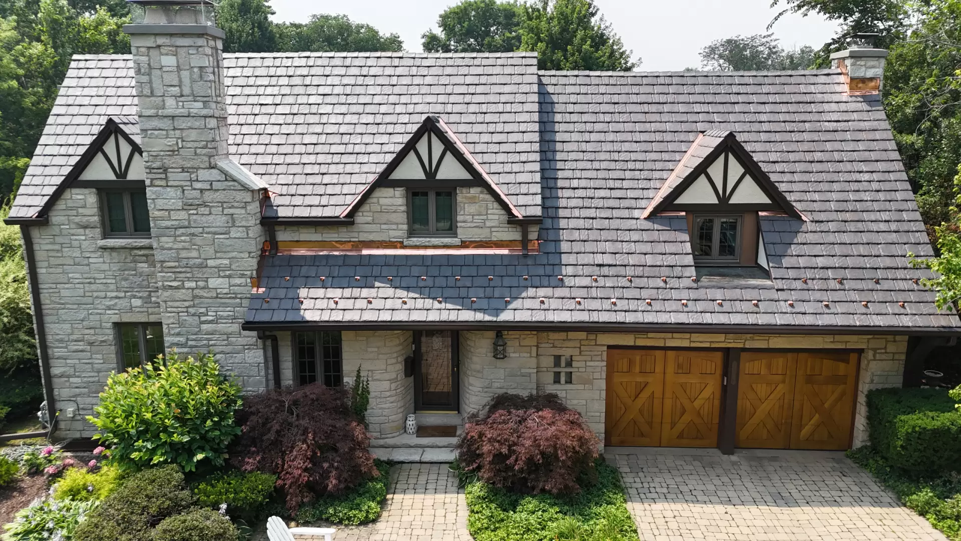 Large skylight next to window on grey roof