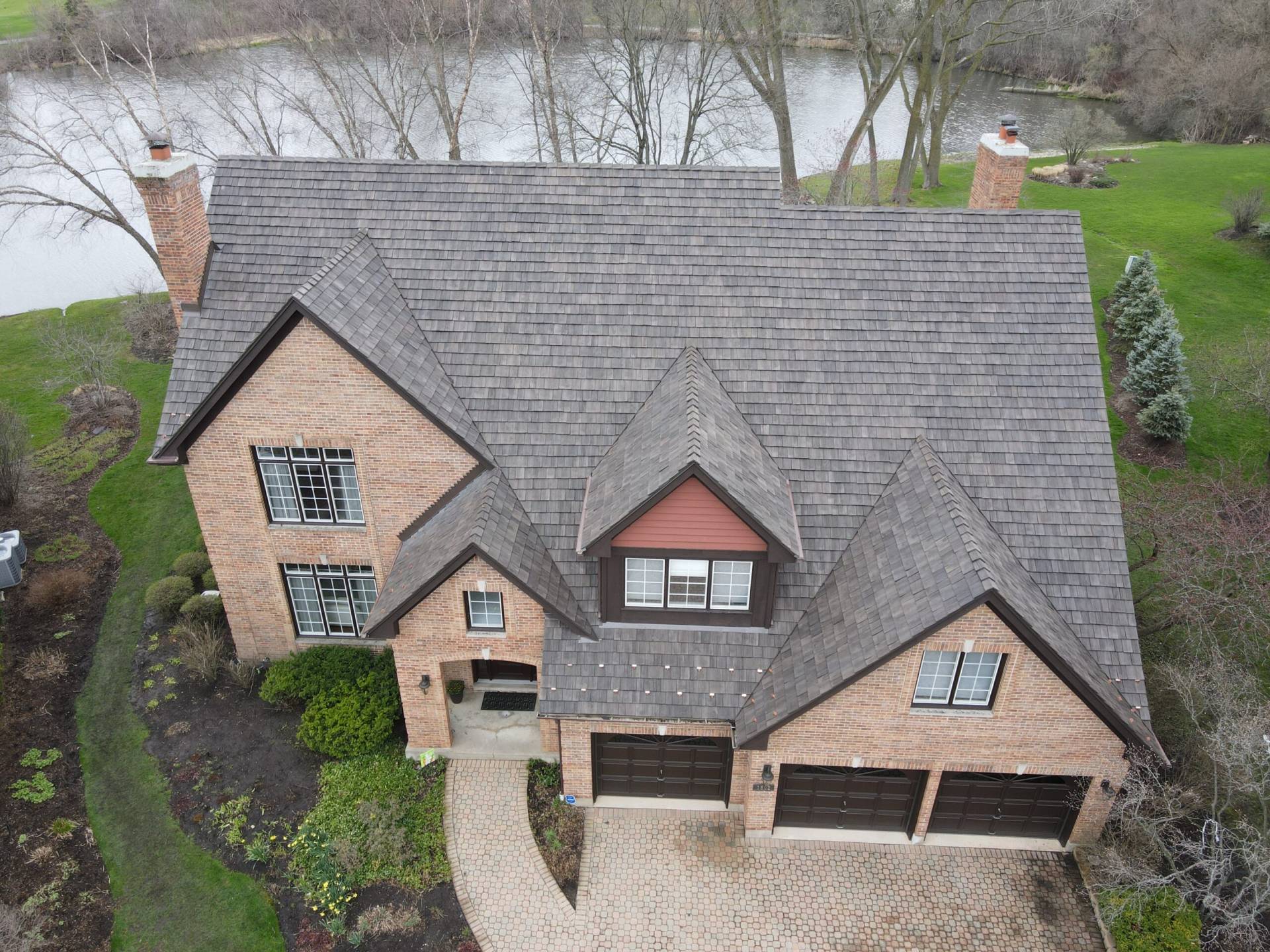 Large skylight next to window on grey roof