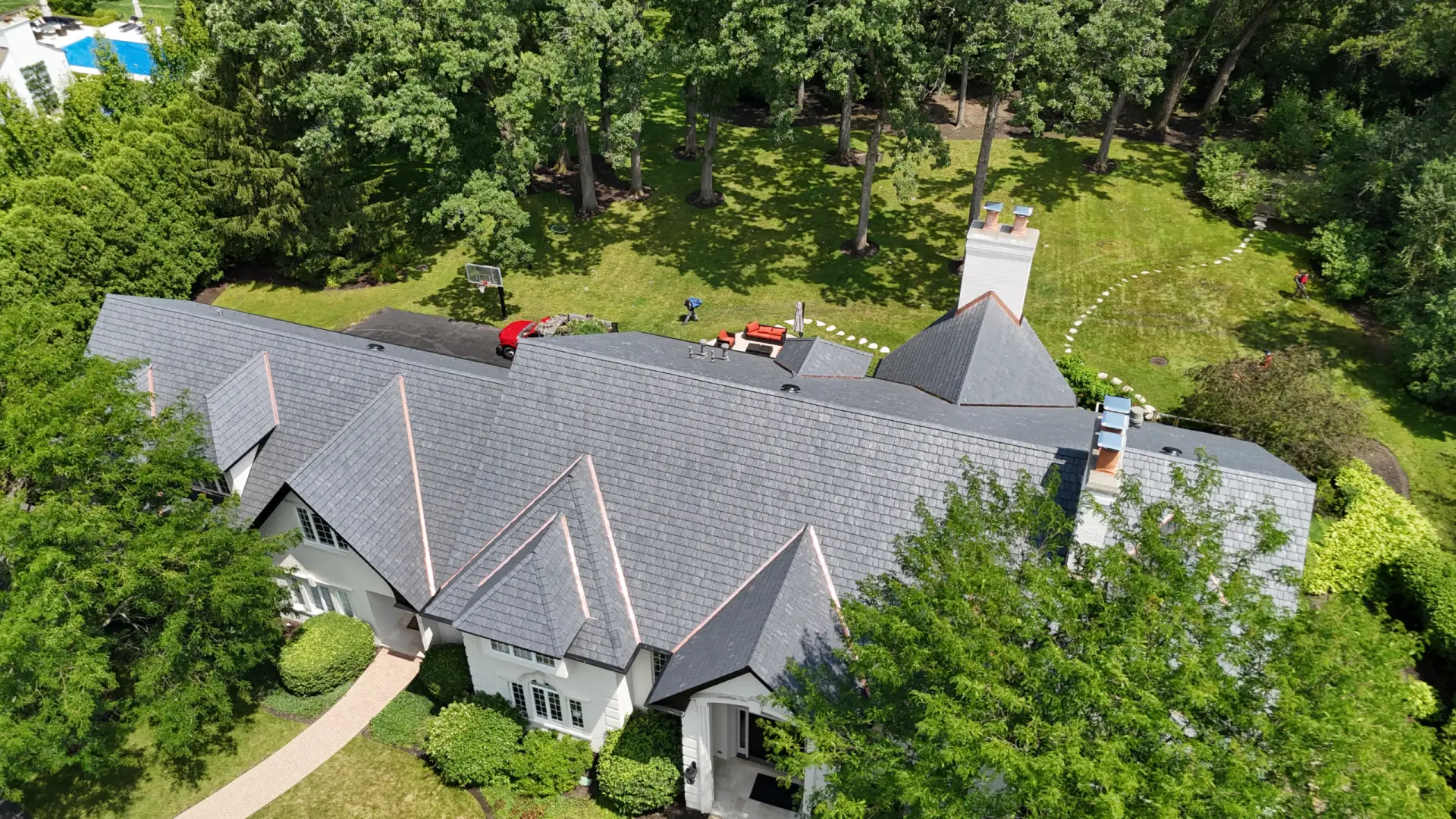 Large skylight next to window on grey roof