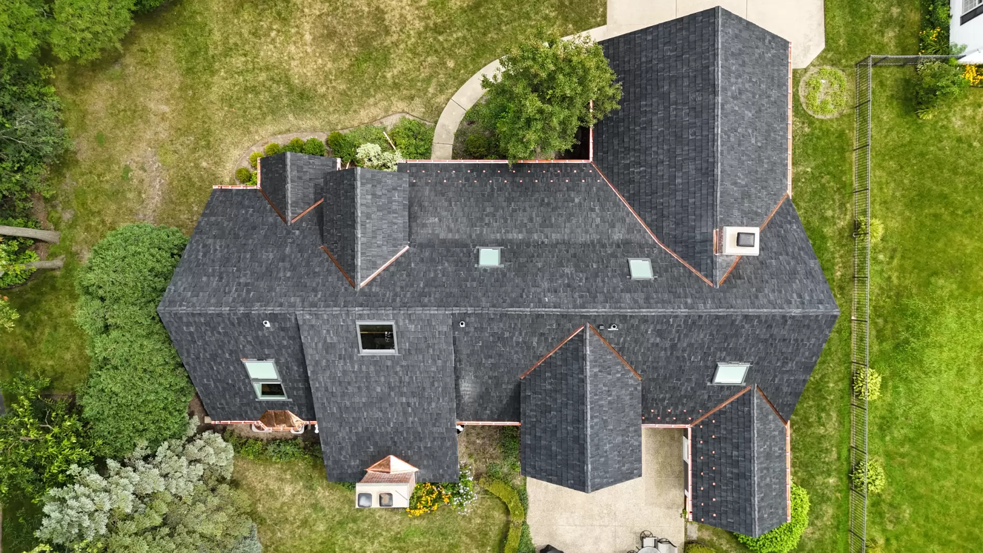 Large skylight next to window on grey roof