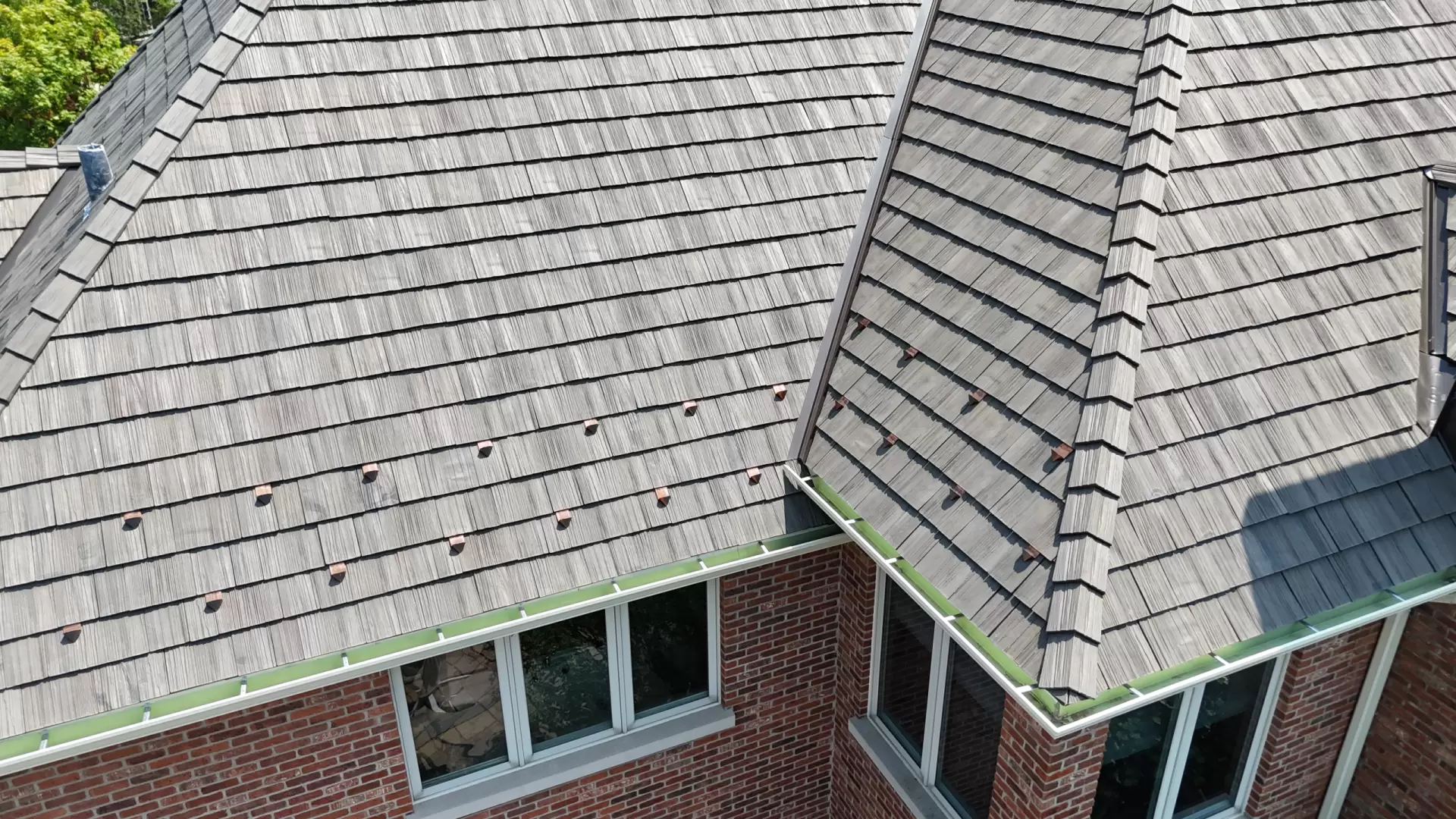 Large skylight next to window on grey roof
