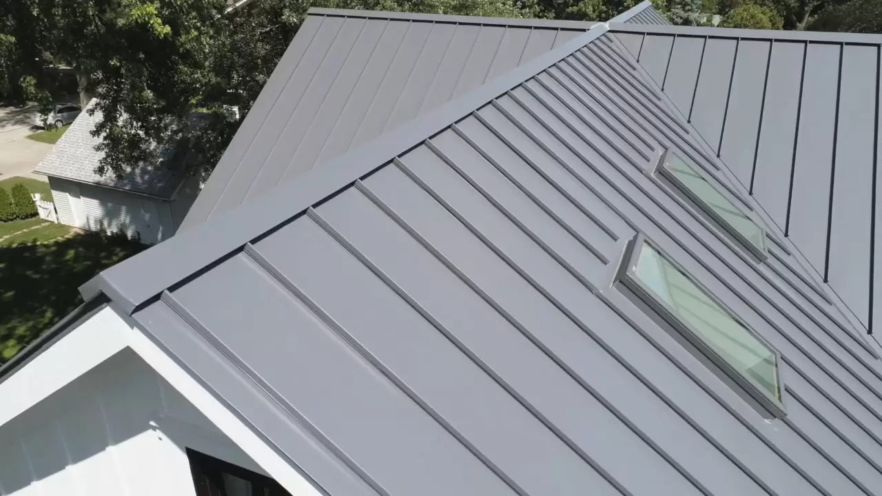 Two skylights on dark metal roof