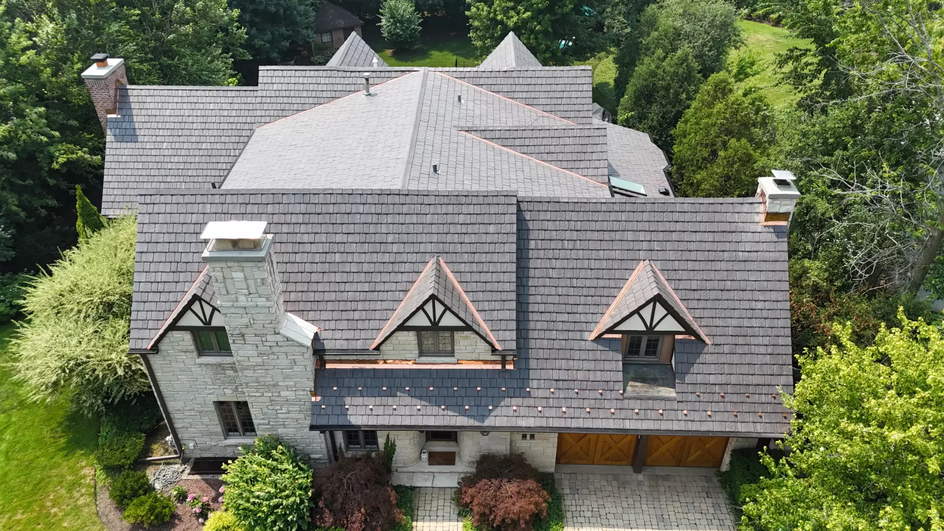 Large skylight next to window on grey roof