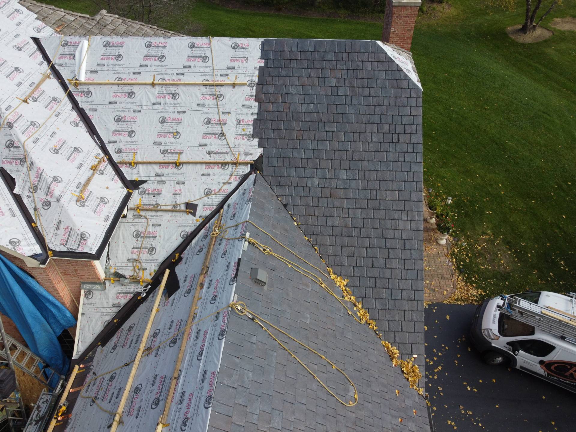 Large skylight next to window on grey roof