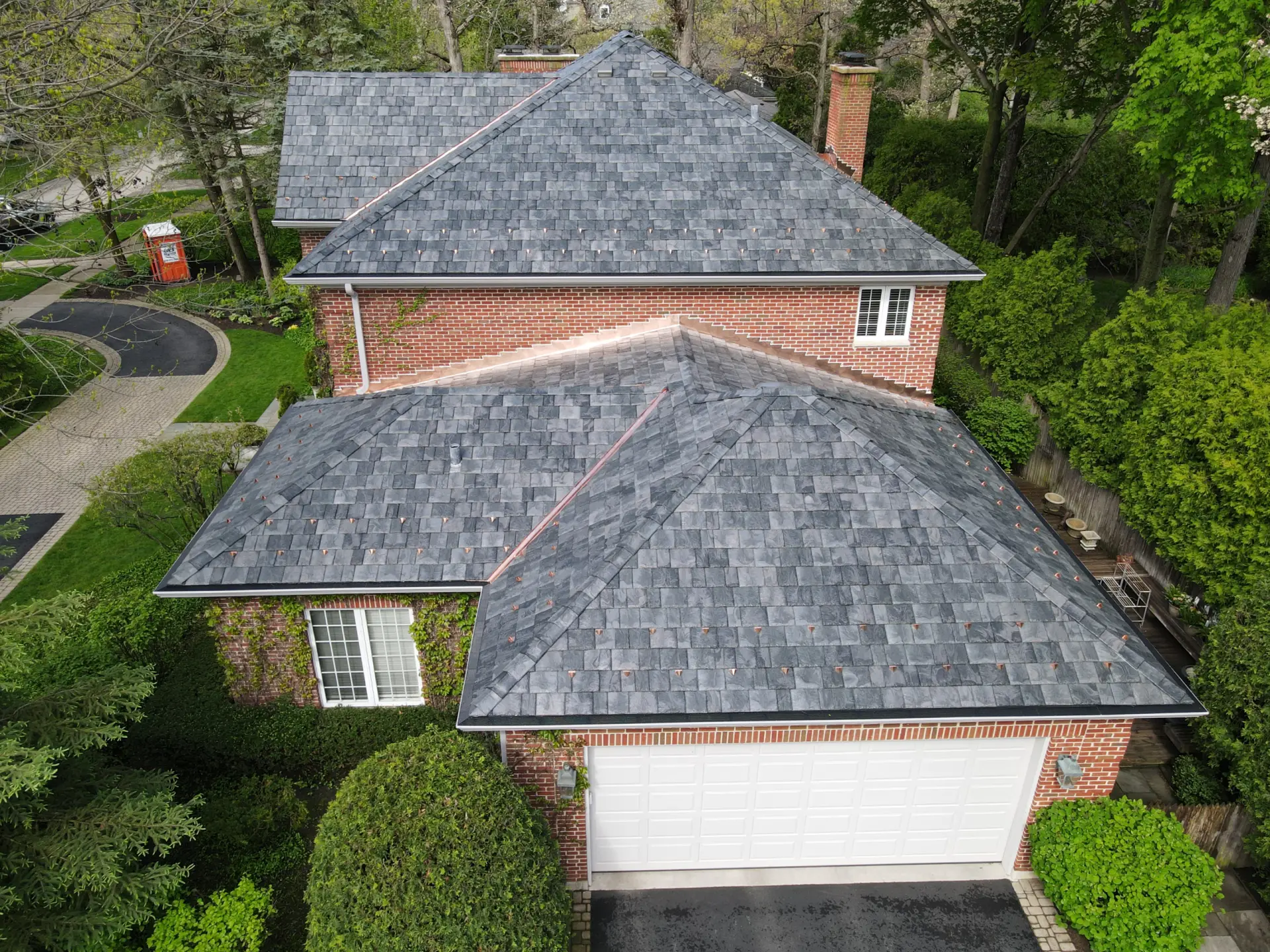 Large skylight next to window on grey roof