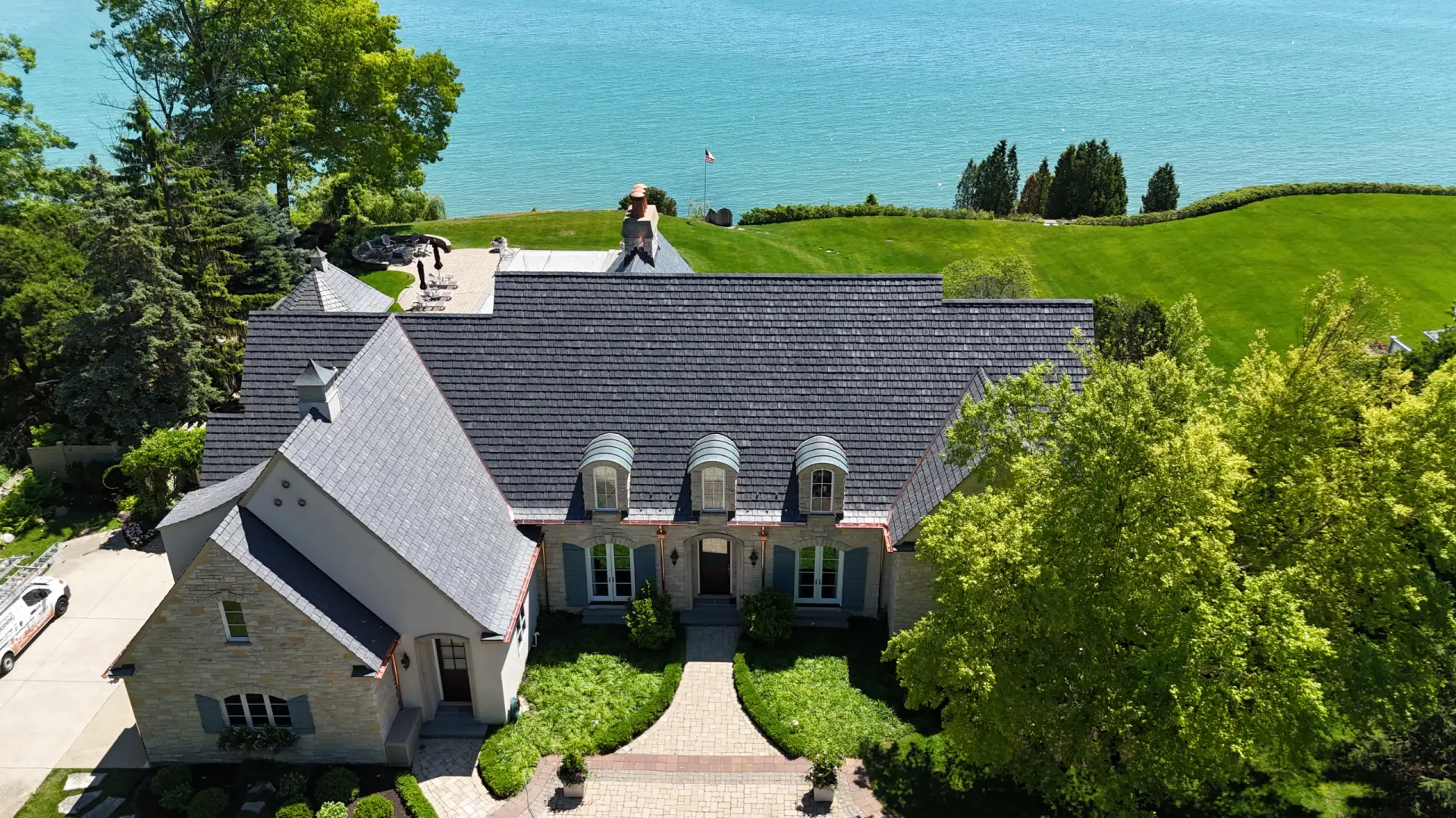 Large skylight next to window on grey roof