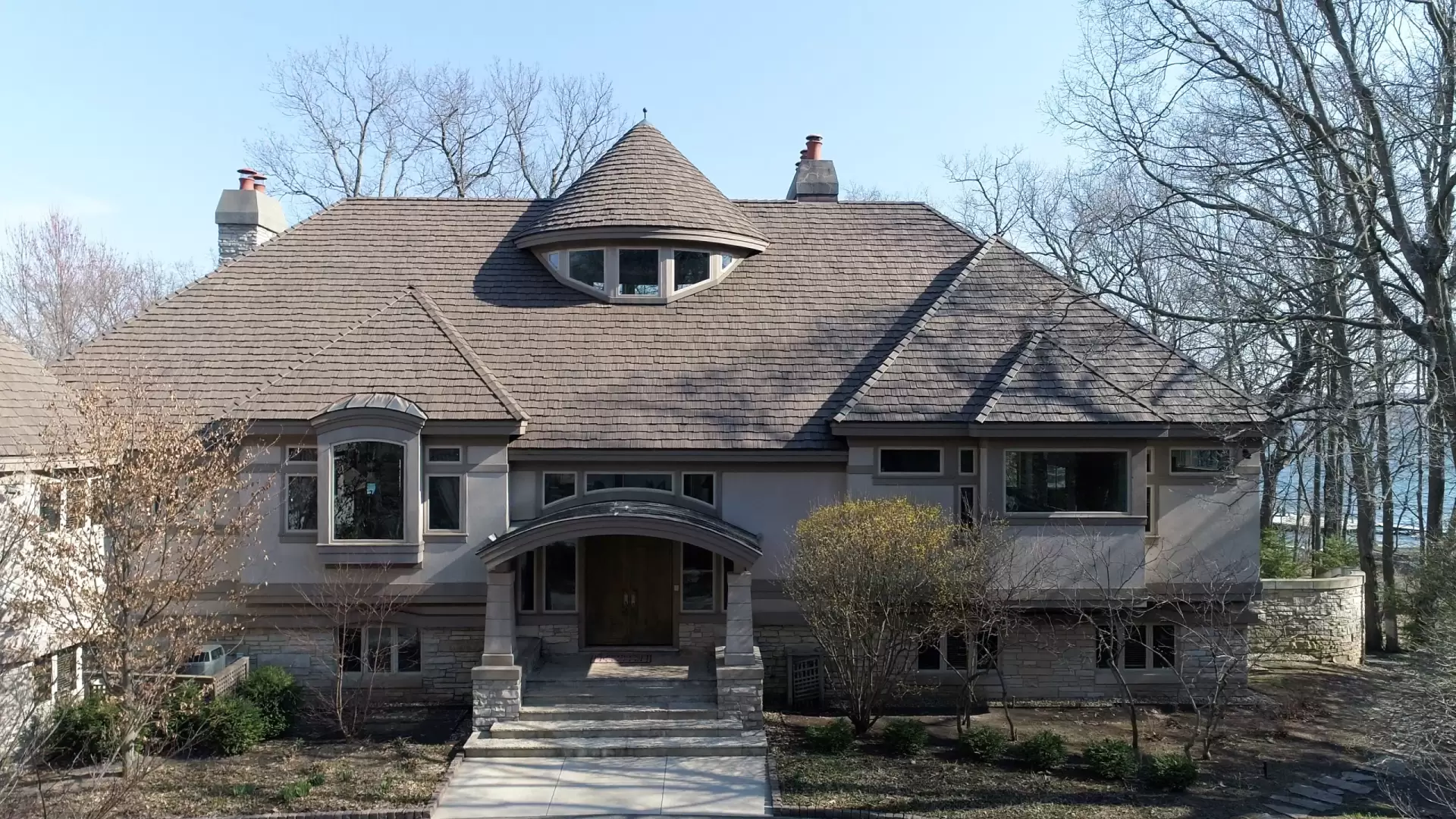 Large skylight next to window on grey roof