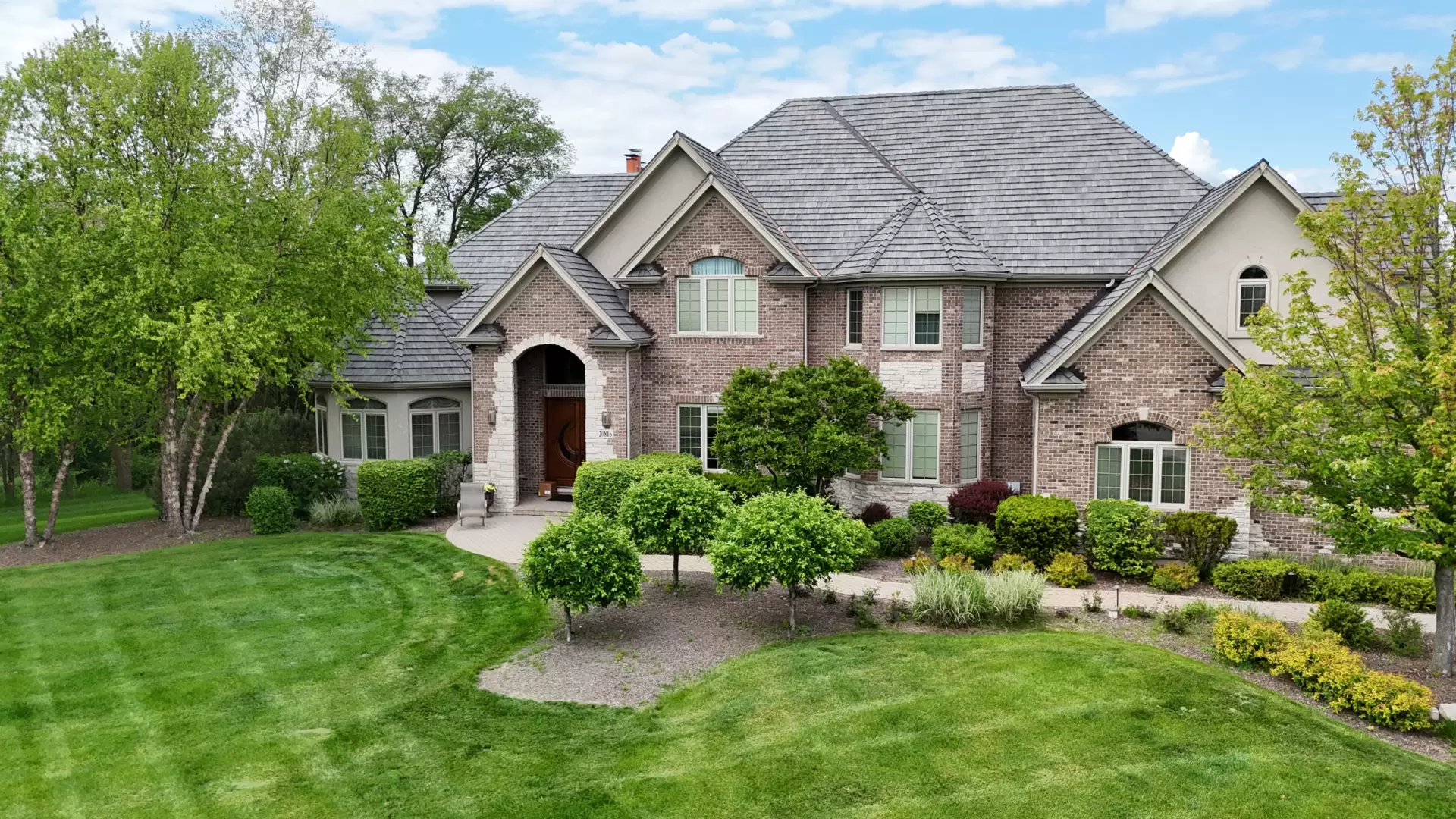 Large skylight next to window on grey roof