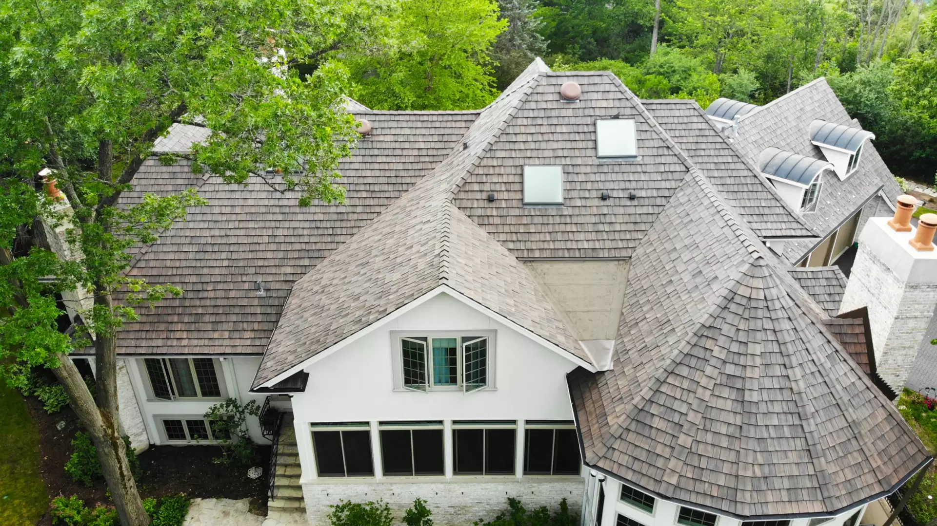 Large skylight next to window on grey roof