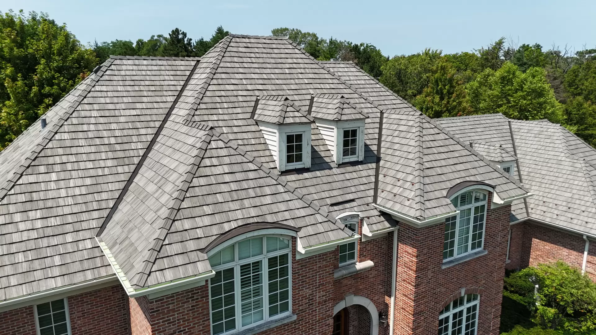 Large skylight next to window on grey roof